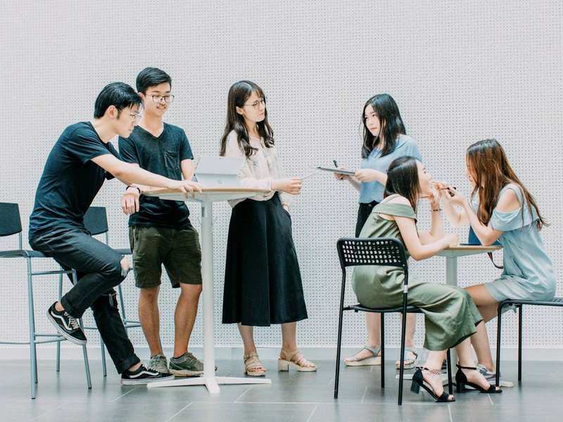 Temporary stock image representing a collaborative team discussion