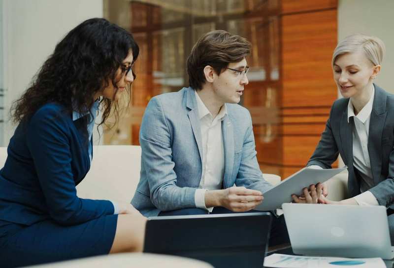 Temporary stock image of colleagues collaborating in a team meeting